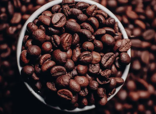 Roasted coffee beans representing caffeine